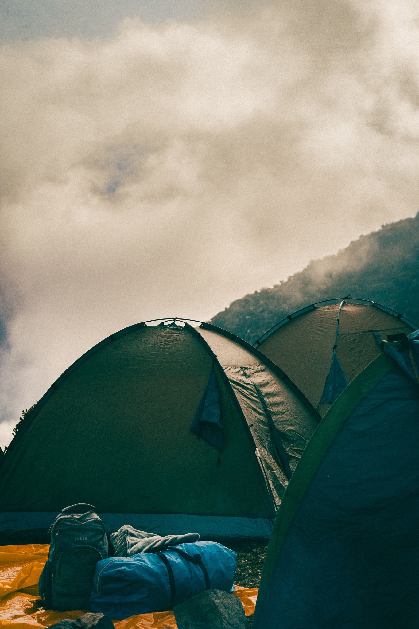 Camp tents in misty mountain weather